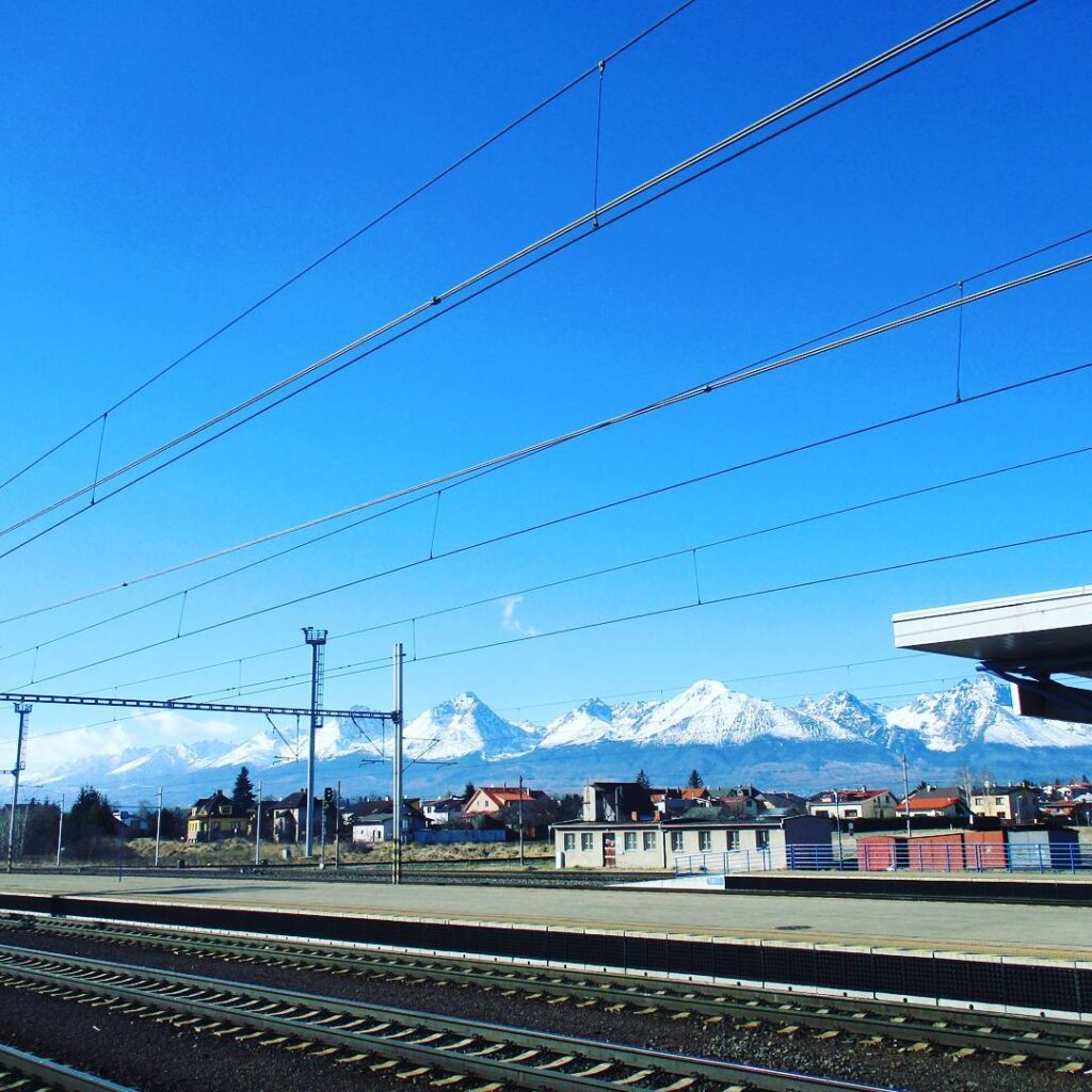 Train station with Tatras mountain range in the background